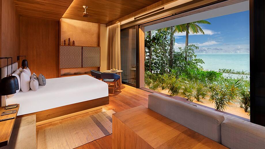 beachfront terrace pool suite bedroom view