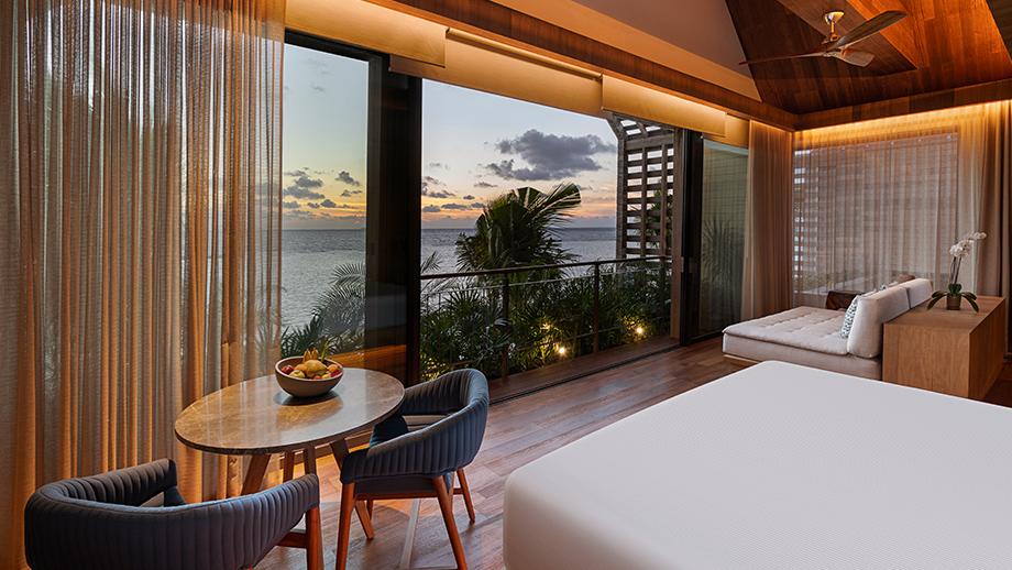 oceanfront balcony pool suite bedroom with view