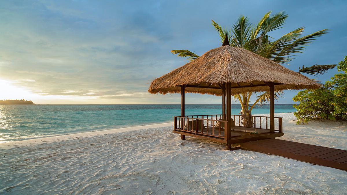 Thai Sala at Sunrise with a stunning view of a Maldivian Beach 