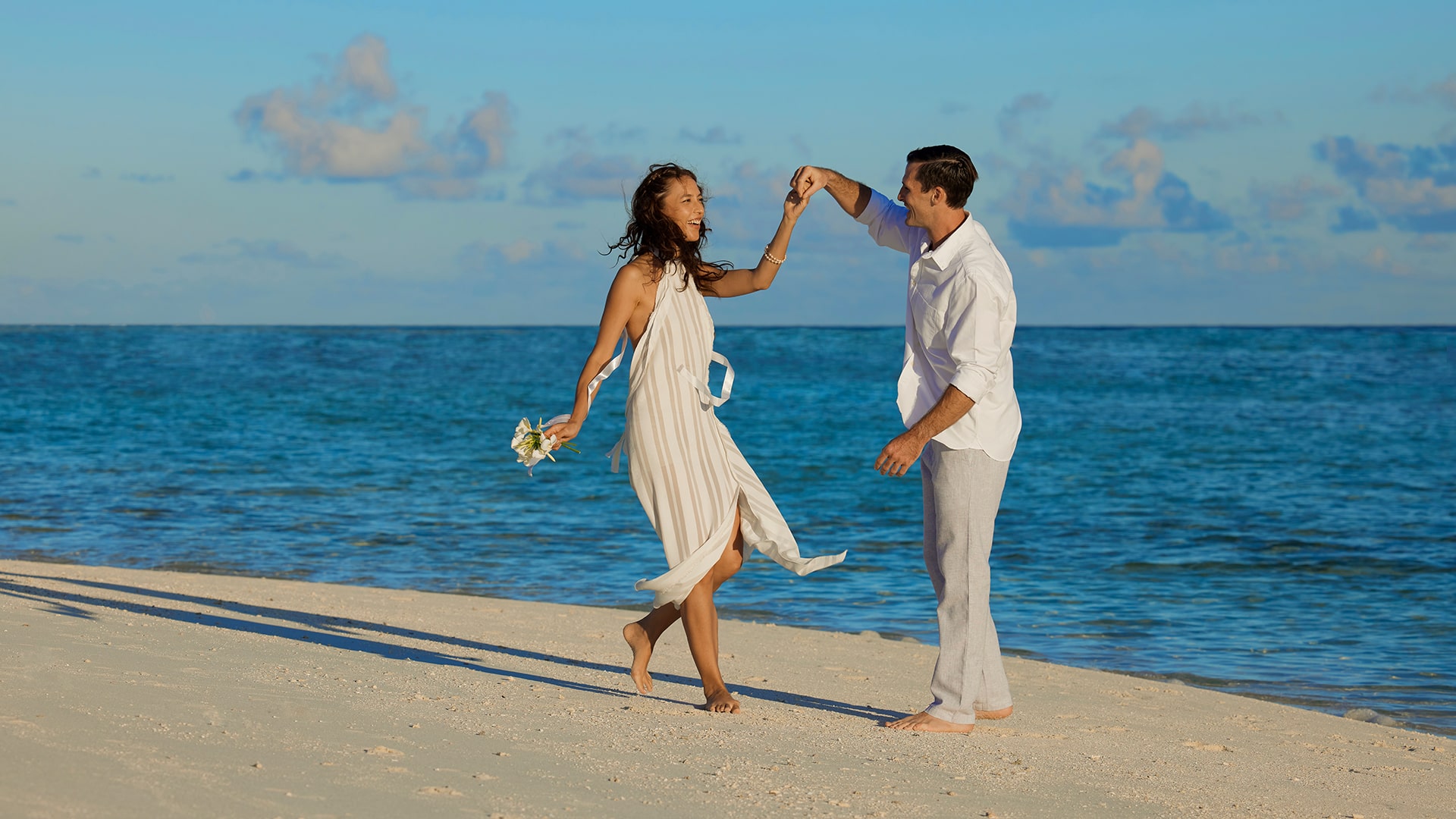 Banyan Tree Vabbinfaru Maldives couple dancing on the beach