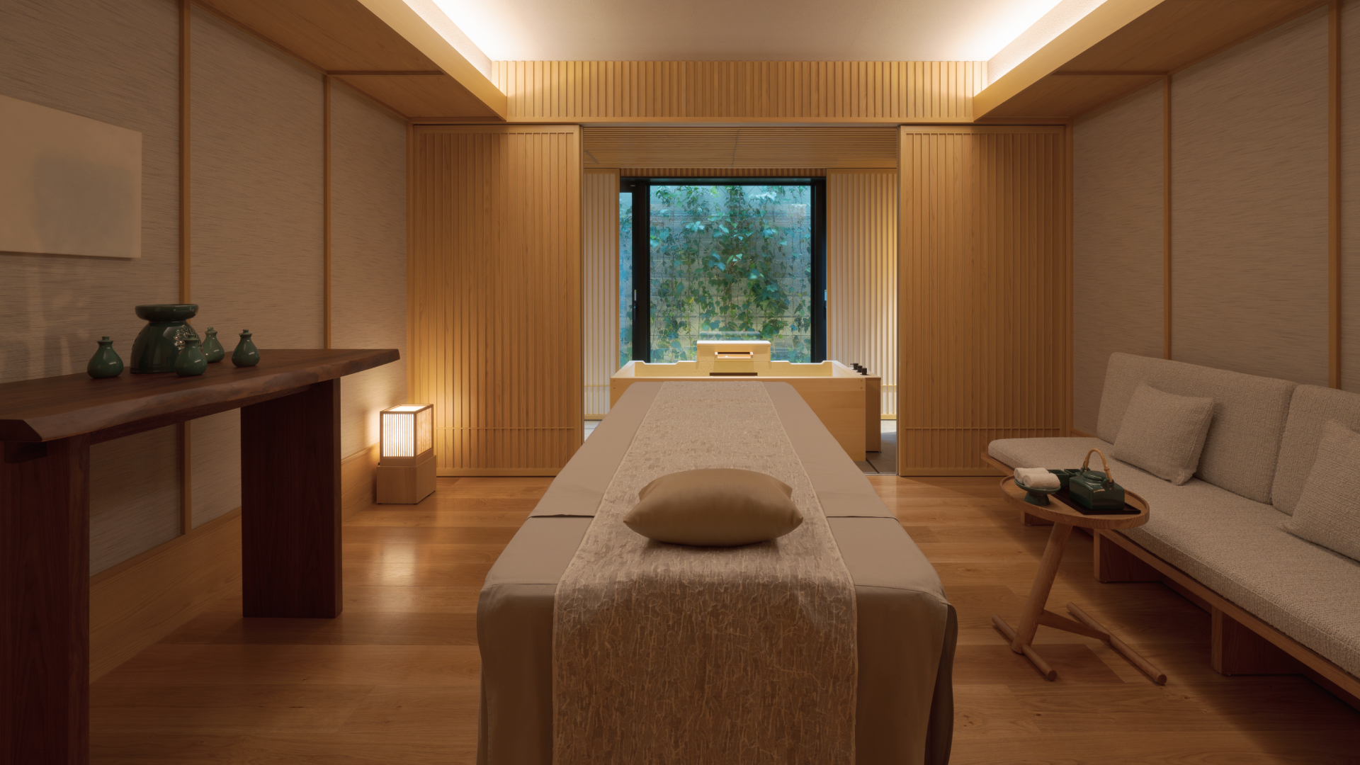 Massage table in serene room, Banyan Tree Higashiyama Kyoto, with wooden decor and soft lighting.