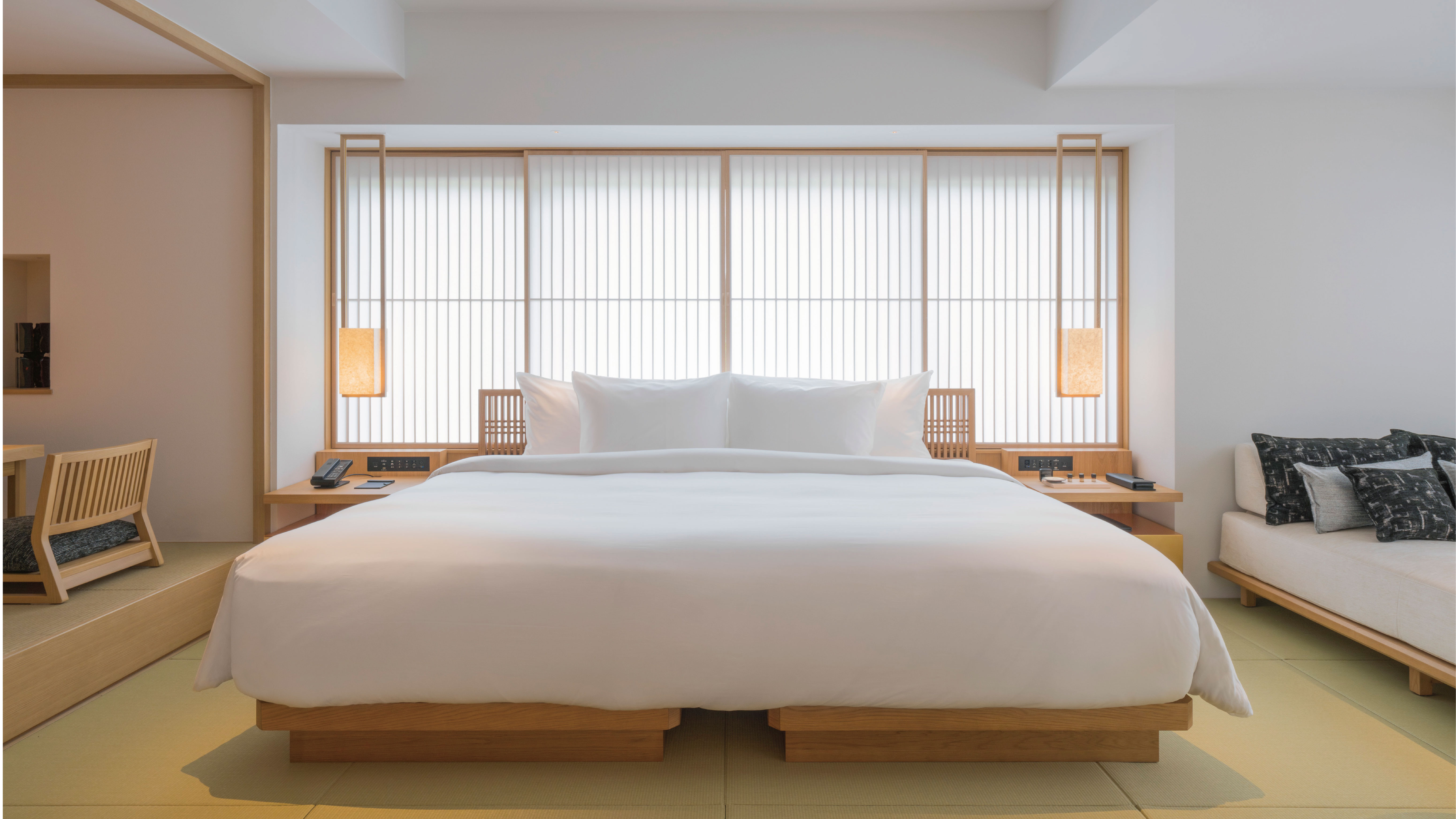 Cozy bed setup with modern decor in Banyan Tree Kyoto Japan room.