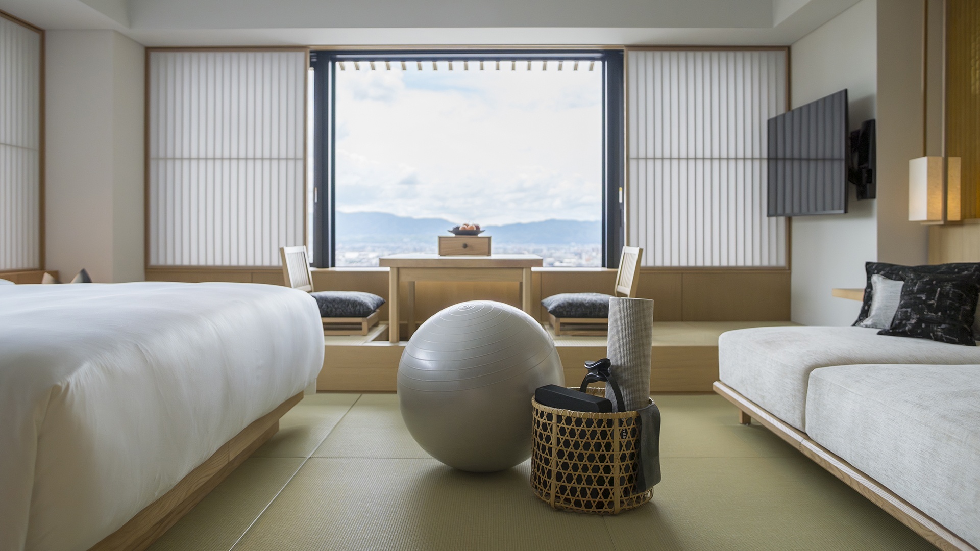 Exercise ball and mat rest on tatami floor in a serene Banyan Tree Higashiyama Kyoto room.