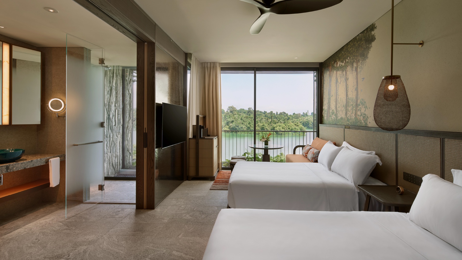 Sanctuary Double Double room with two beds overlooks lush greenery and the Upper Seletar Reservoir. 