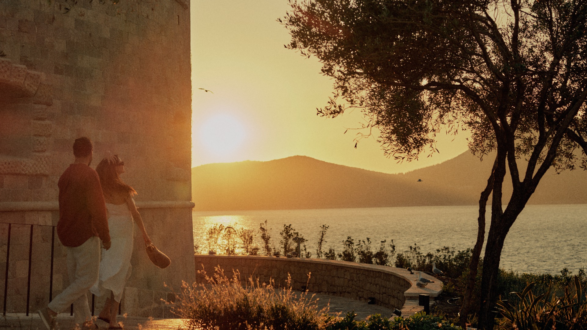 Couple walking at sunset on Mamula Island
