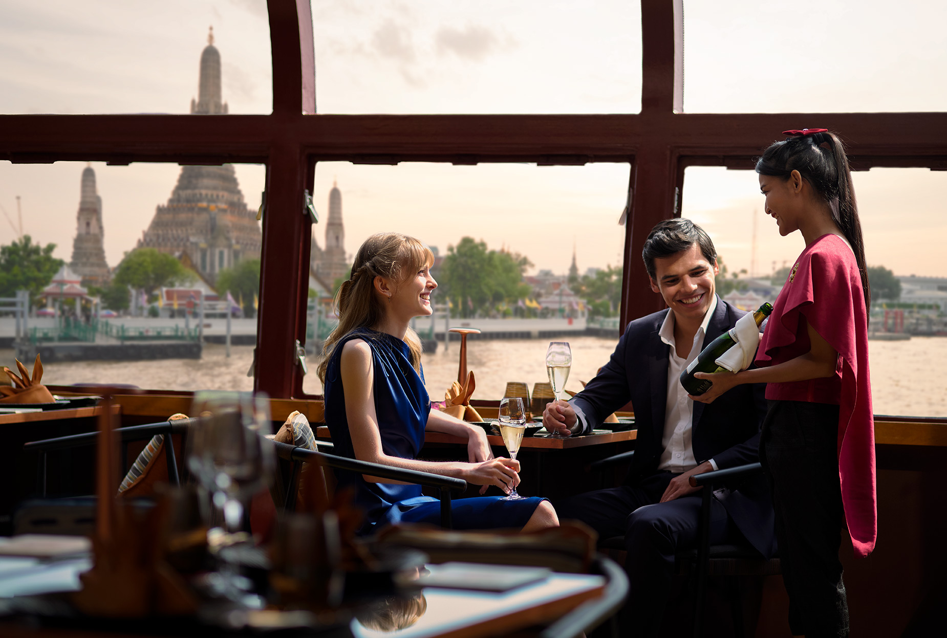 Banyan Tree Bangkok Saffron Cruise Lifestyle Couple with staff