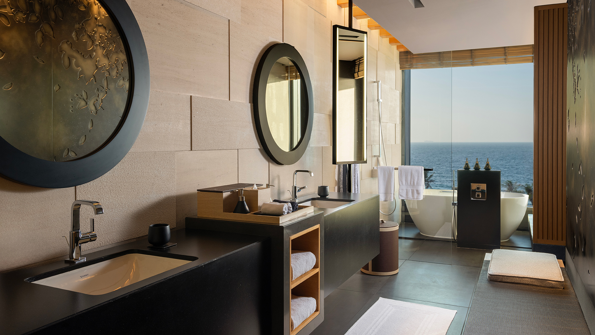 Luxurious oceanview bathroom at Banyan Tree Dubai featuring dual vanities, a deep soaking tub, and contemporary design with panoramic Arabian Gulf views.