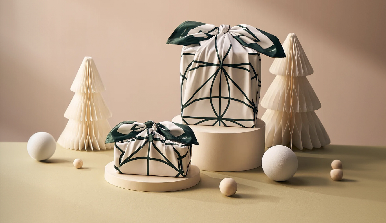 Two tastefully wrapped presents in Banyan Tree branded wrapping