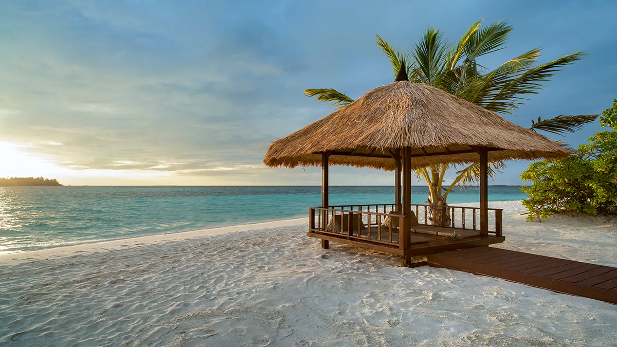 Thai Sala at Sunrise with a stunning view of a Maldivian Beach 